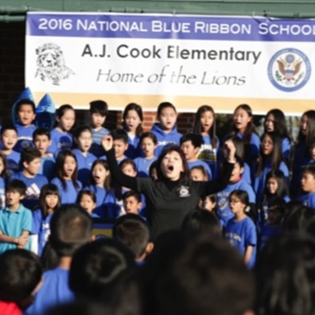 Choir students sing in honor of being awarded a National Blue Ribbon school.