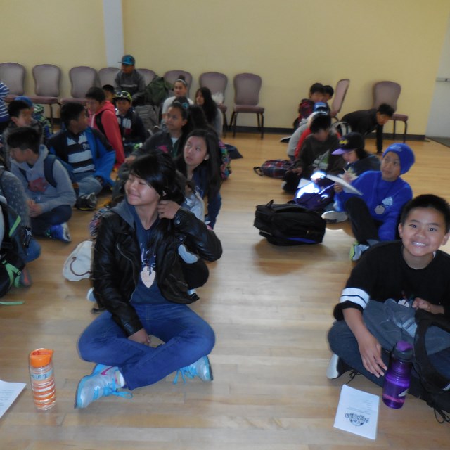 Cook Lions are indoors when preparing for another educational activity.