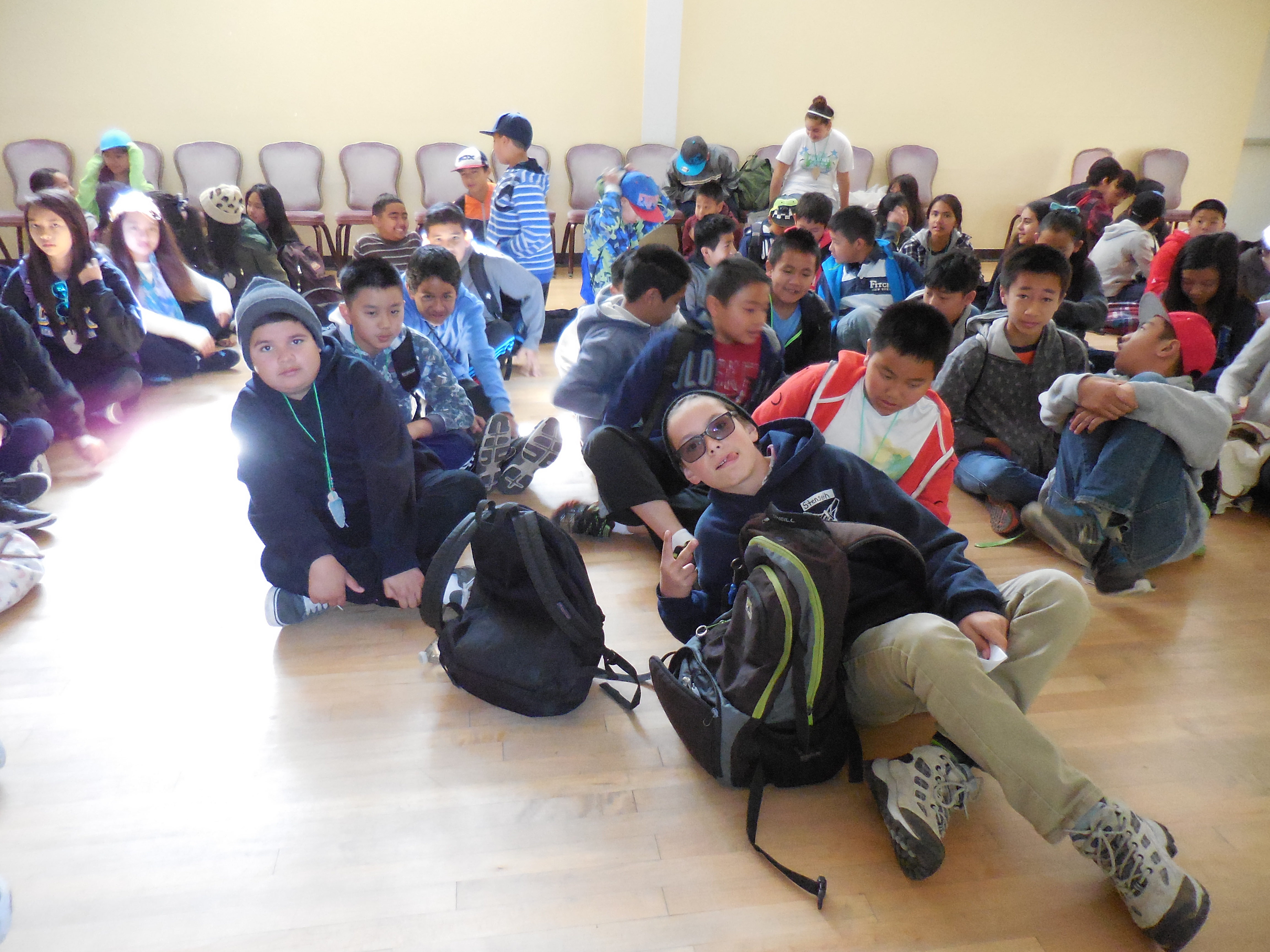 These boys get into groups before following directions for the next activity.