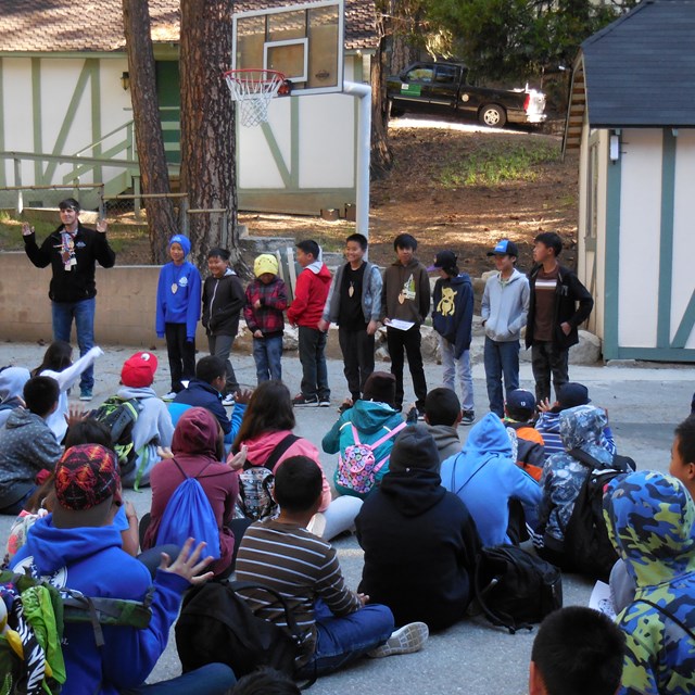 A couple of students volunteer as participants for a fun activity.