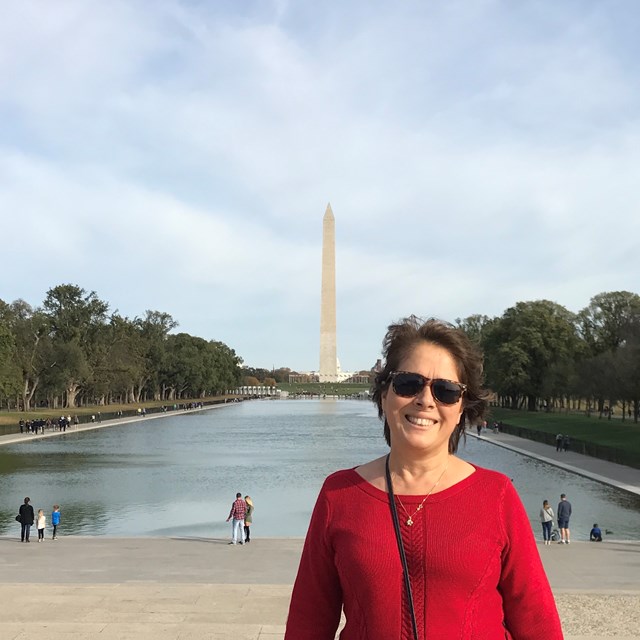 A wonderful educator stands miles away from the Washington Monument.